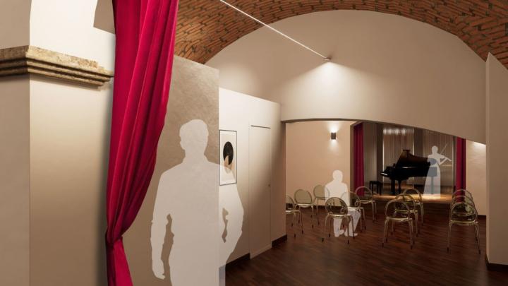 Viotti Club (immagina del profilo Facebook di Camerata Ducale) Sala da concerto con pianoforte, con sagome di spettatore e violinista